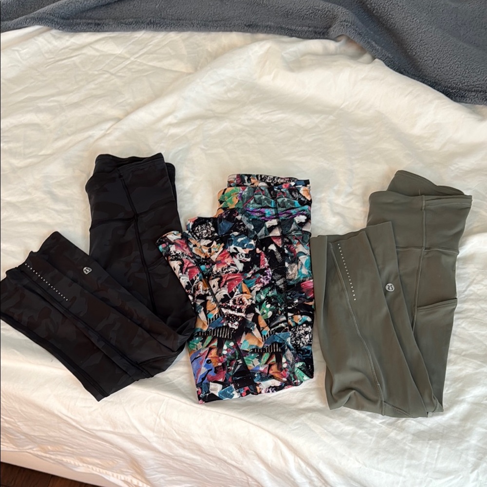 3 PAIRS of Lululemon athletics: black camo, modern multicolor, and olive green